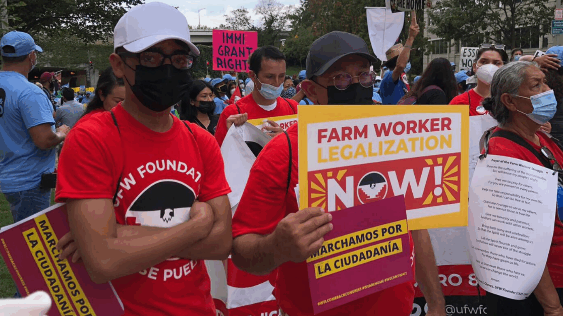 Farm worker advocates protest in Washington, D.C., holding signs and banners for labor rights and fair treatment.
